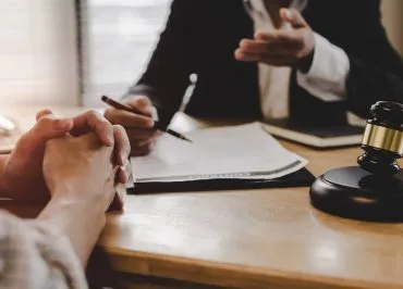 Client in front of a solicitor.